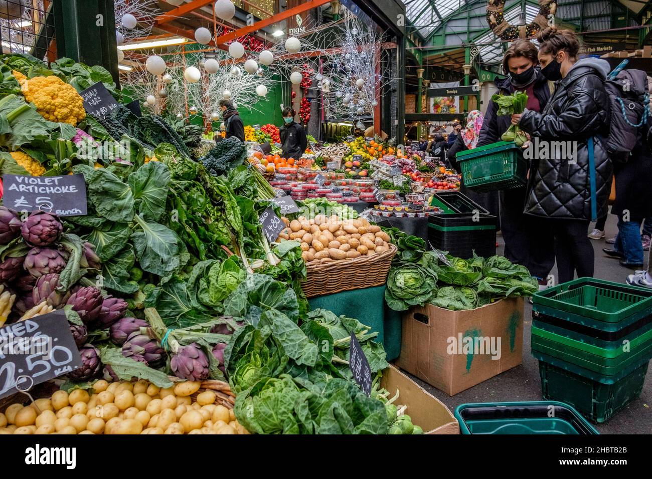 Fresh vegetable produce on stall at Borough Market during leadup to Christmas, London, United
