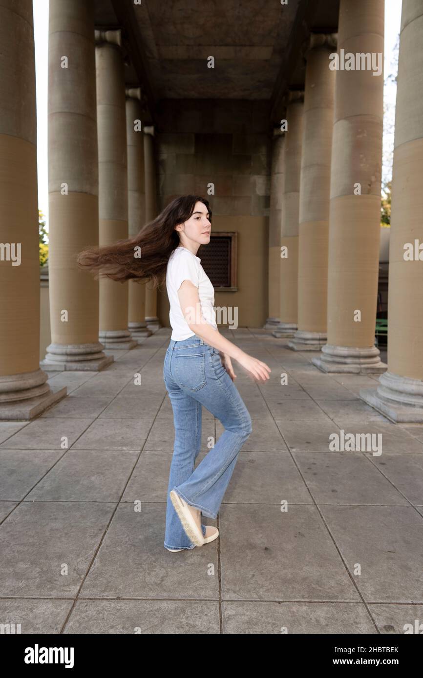 Teenage Woman Doing Jazz Dance Moves in a Loggia Stock Photo