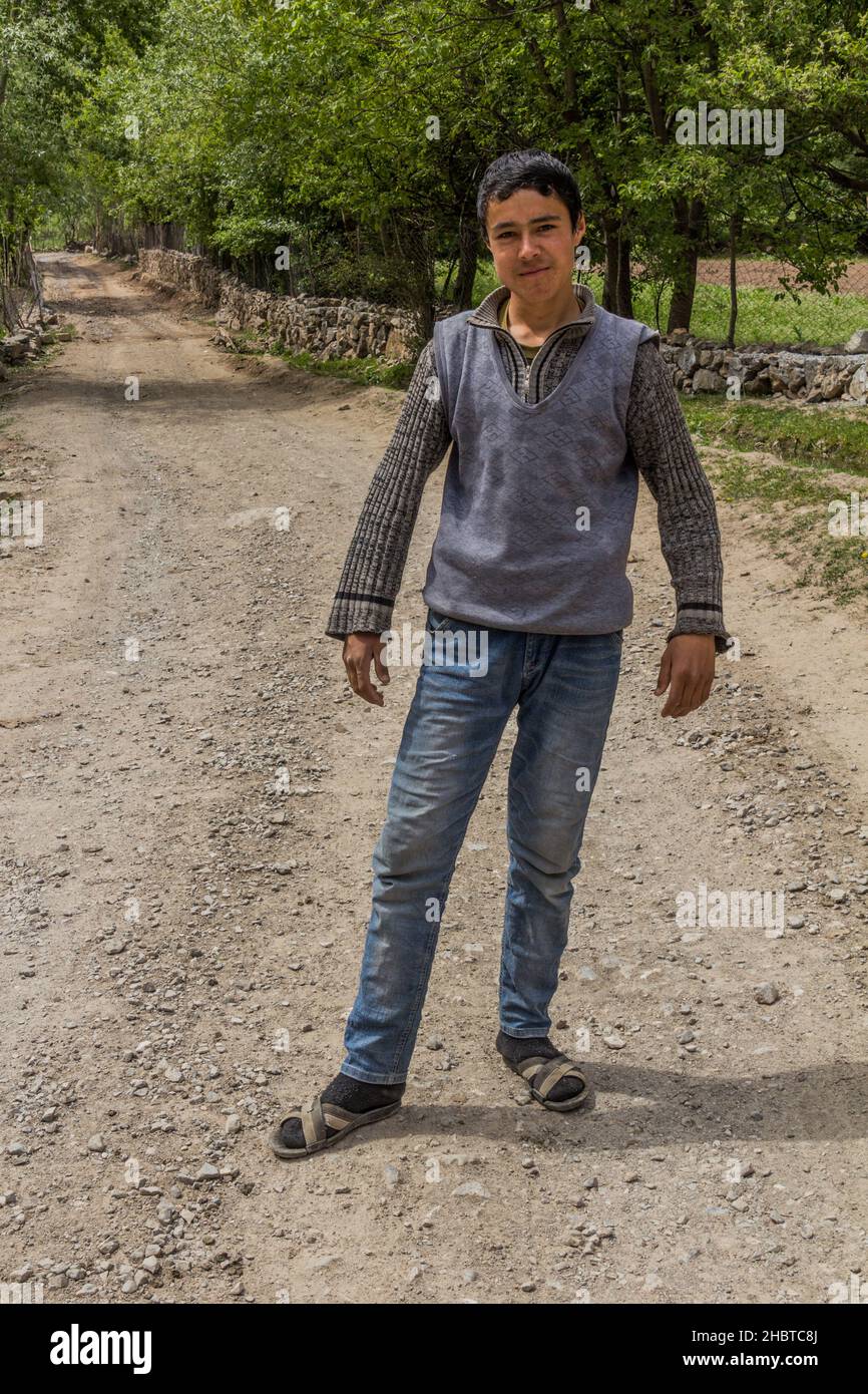 HAFT KUL, TAJIKISTAN - MAY 11, 2018: Boy in Marguzor Haft Kul in Fann mountains, Tajikistan Stock Photo