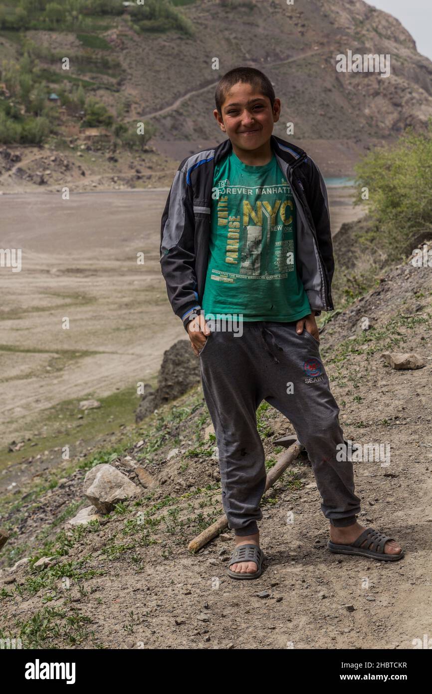 HAFT KUL, TAJIKISTAN - MAY 11, 2018: Boy in Marguzor Haft Kul in Fann mountains, Tajikistan Stock Photo