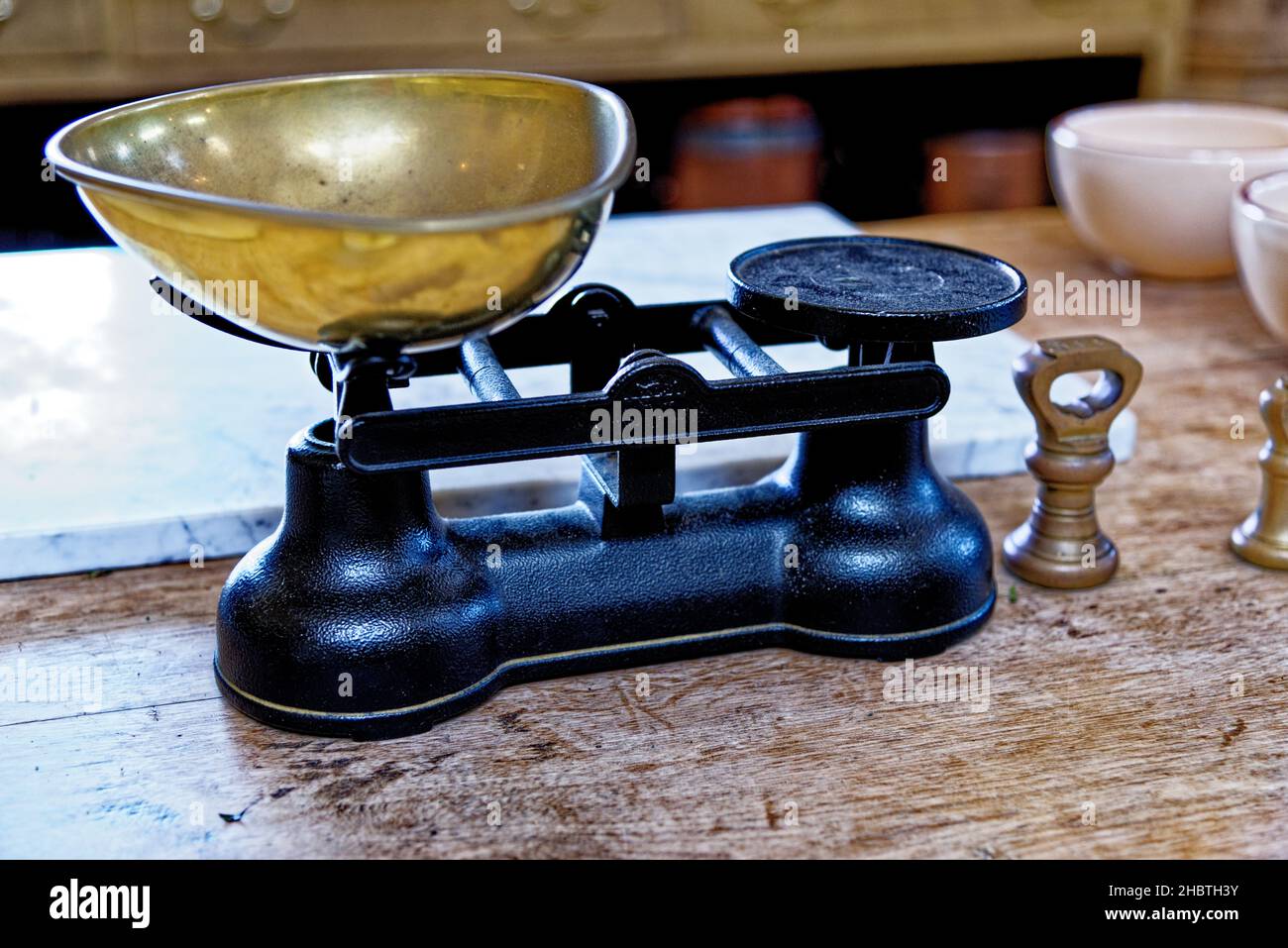 Antique vintage old weight scale in the Kitchen of Culzean Castle - Maybole in Ayrshire Scotland, United Kingdom. 22nd of July 2021 Stock Photo