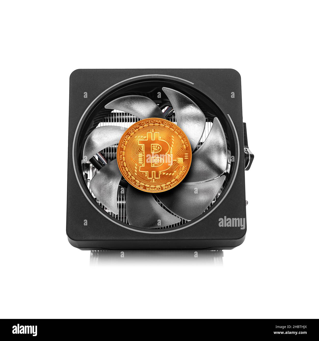Cryptocurrency mining. Bitcoin coin on a computer graphics card component. Stock Photo