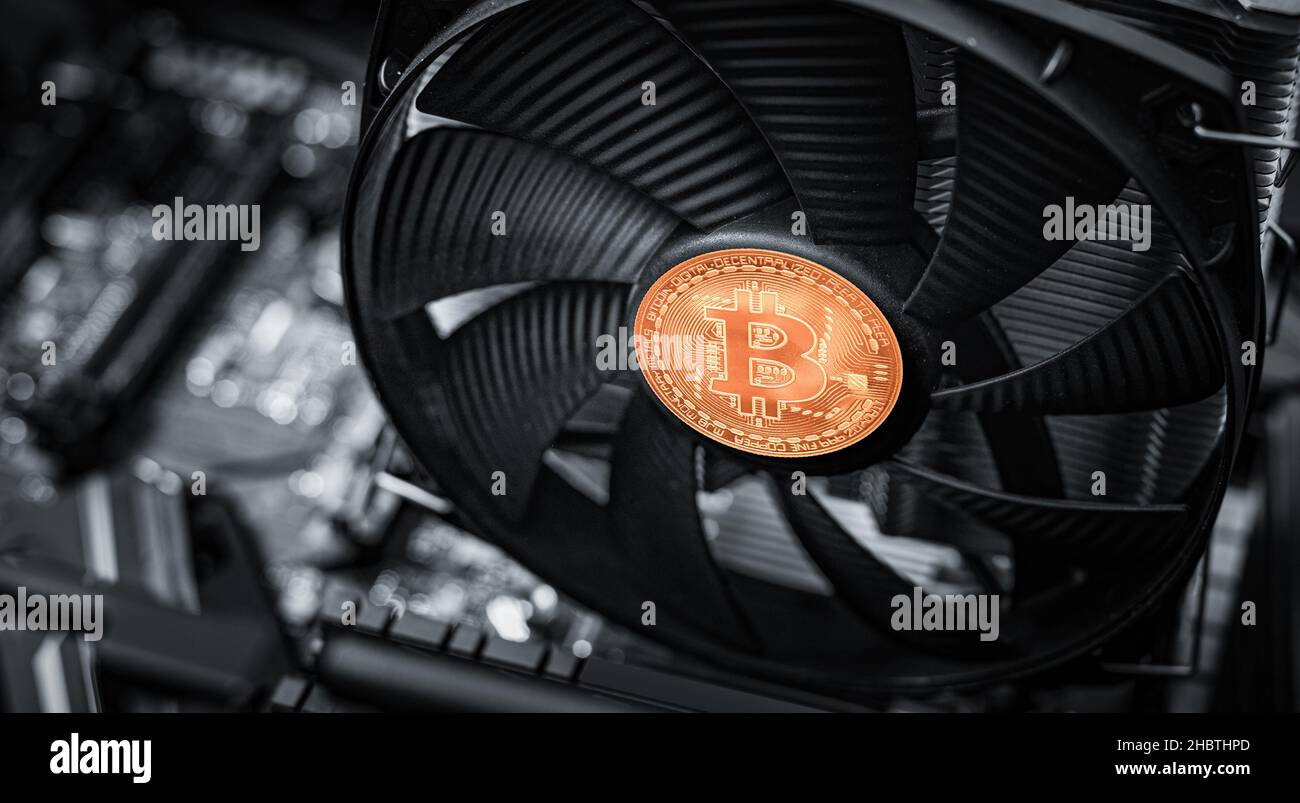 Cryptocurrency mining. Bitcoin coin on a graphic card, video card for