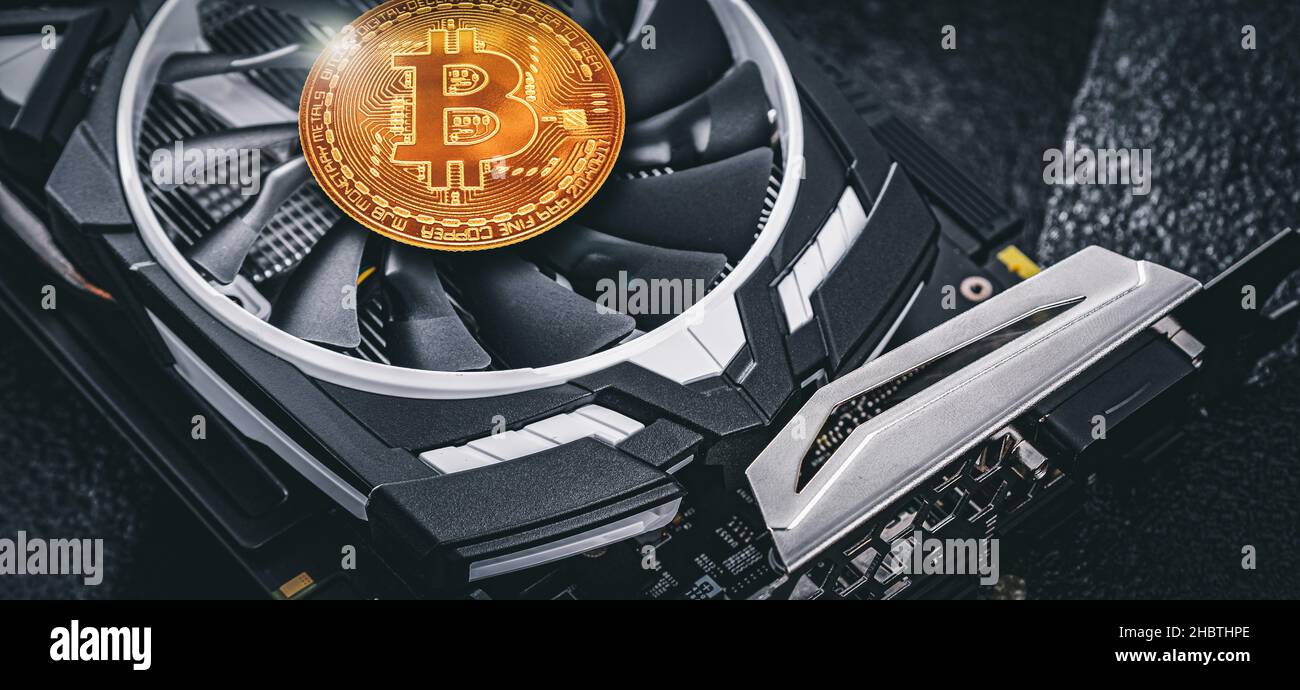 Cryptocurrency mining. Bitcoin coin on a graphic card, video card for  cryptocurrency mining. Cryptocurrency Stock Photo - Alamy