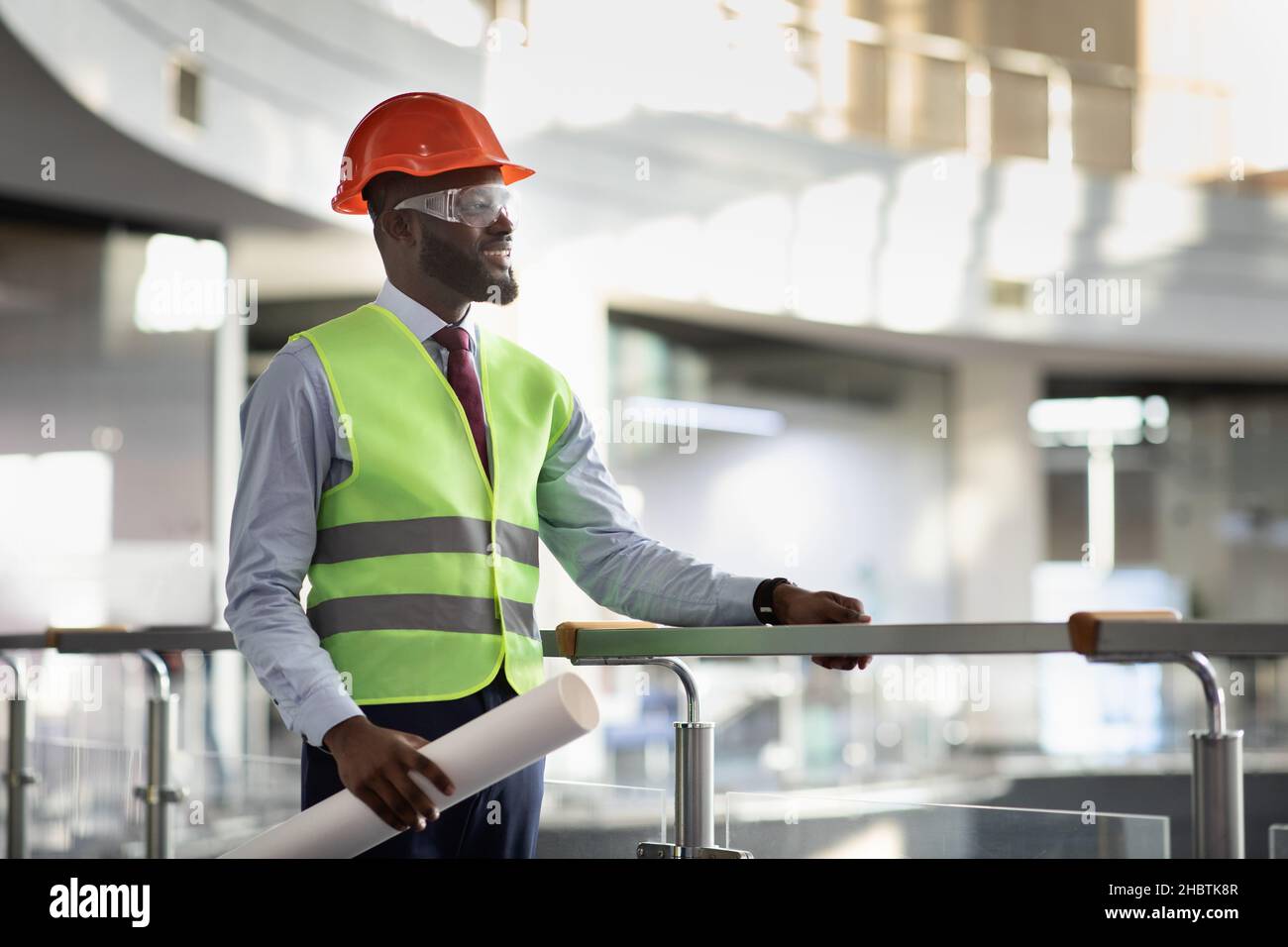 Smiling african american architect visiting building site Stock Photo Alamy