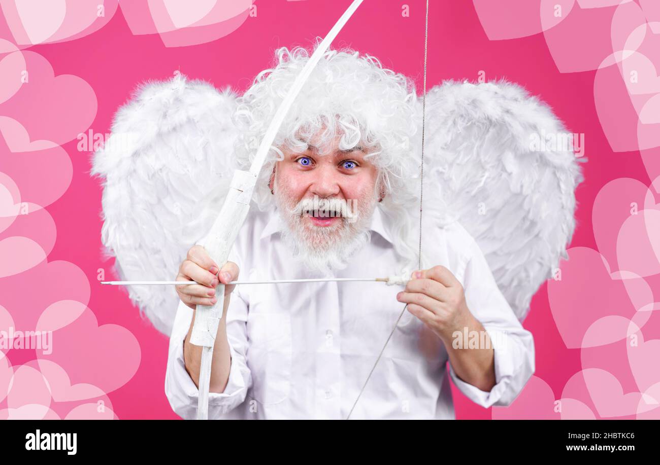Valentines Day. Happy Cupid with bow and arrows. Valentine angel with wings. Arrow of love. Saint valentine. Stock Photo