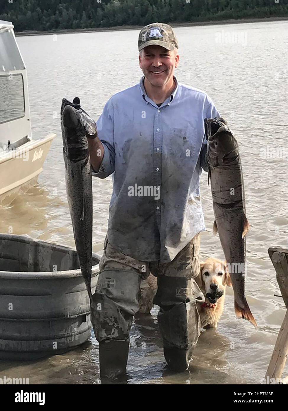 Alaska Senator Dan Sullivan fishing (holding two large fish)  ca.  17 June 2019 Stock Photo