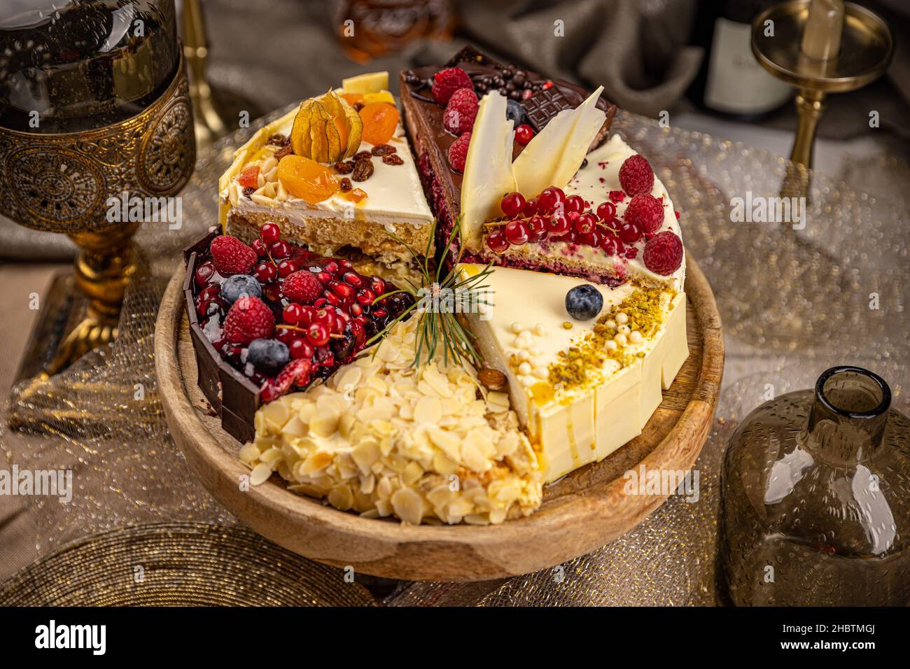 Different slices of various cakes, making a single whole torte Stock Photo