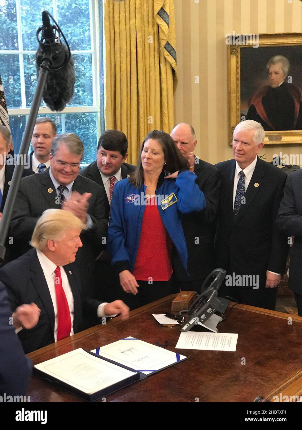 President Trump at his desk in the Oval Office for the 2017 NASA Authorization Bill Signing ca.  21 March 2017 Stock Photo