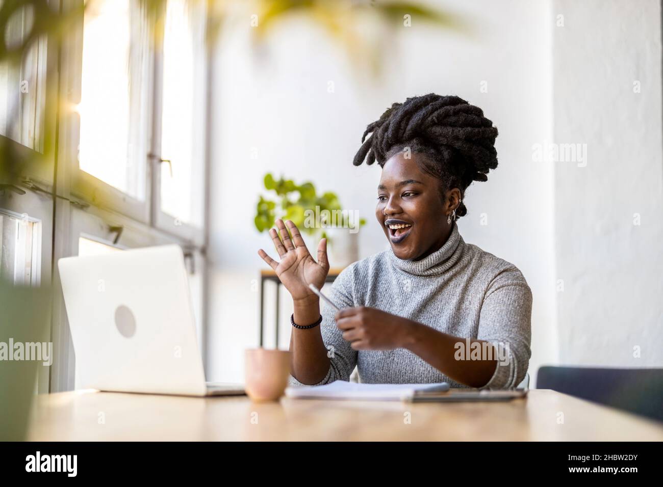 Woman working on laptop in her office Stock Photo