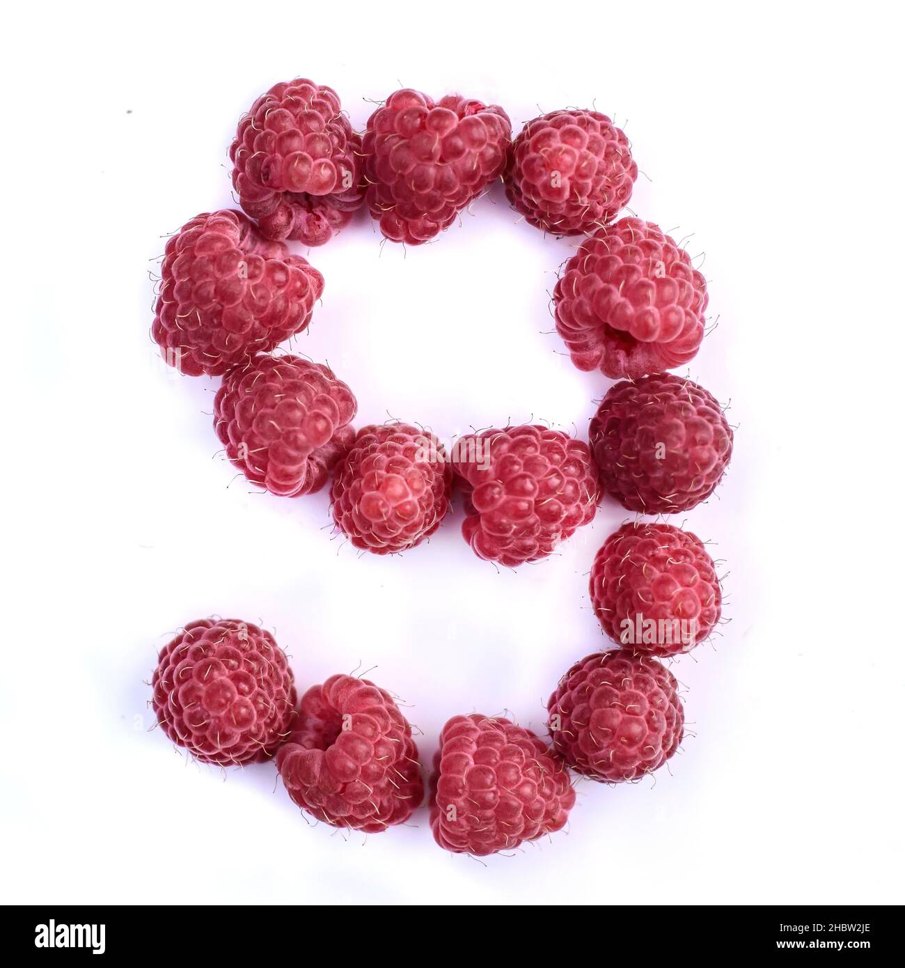 Number R 9 Number 9 of red delicious ripe raspberries, isolate on a white ...