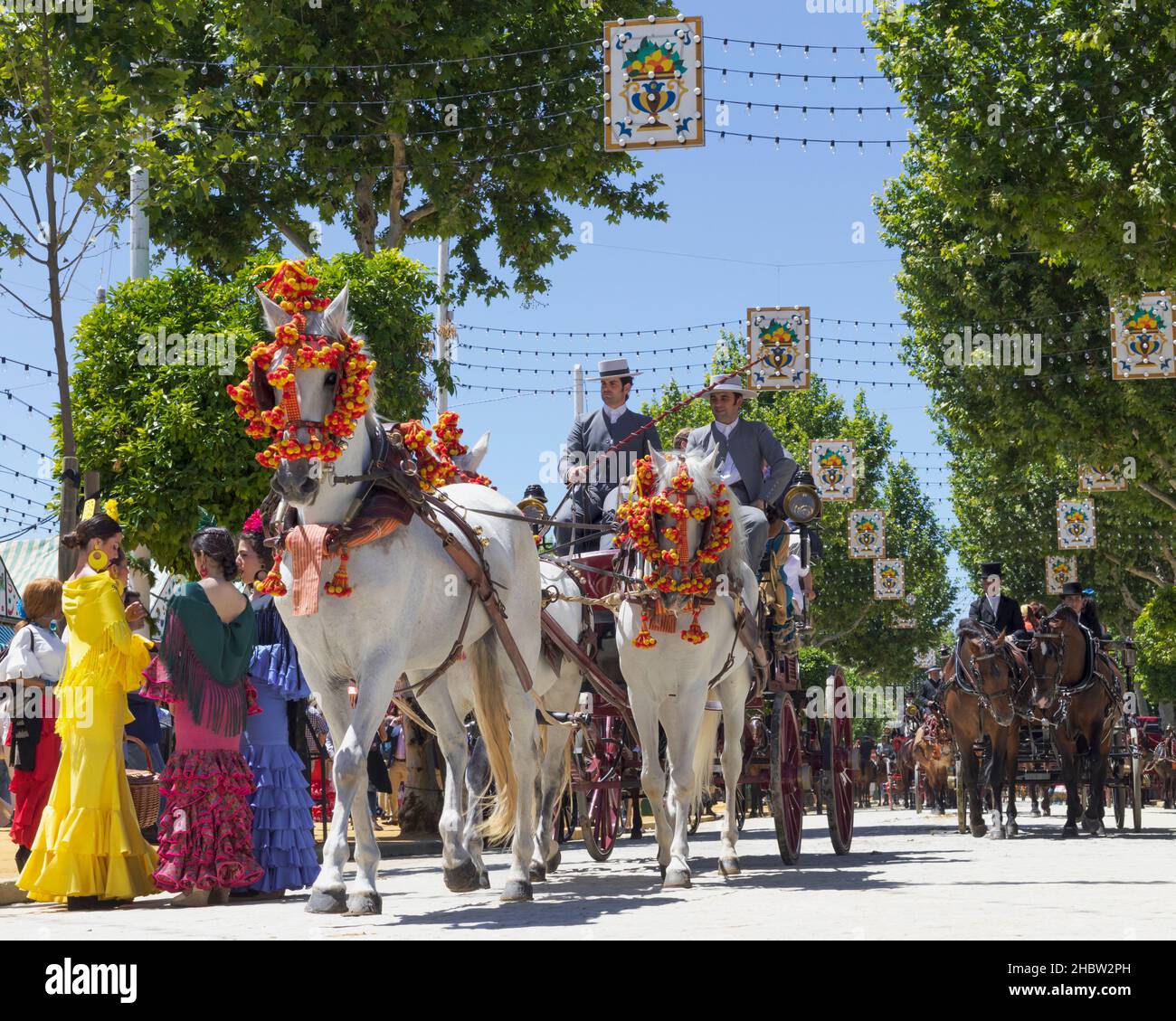 Seville, Seville Province, Andalusia, southern Spain.  Feria de Abril, the April Fair.  Horse and carriage parade. Stock Photo