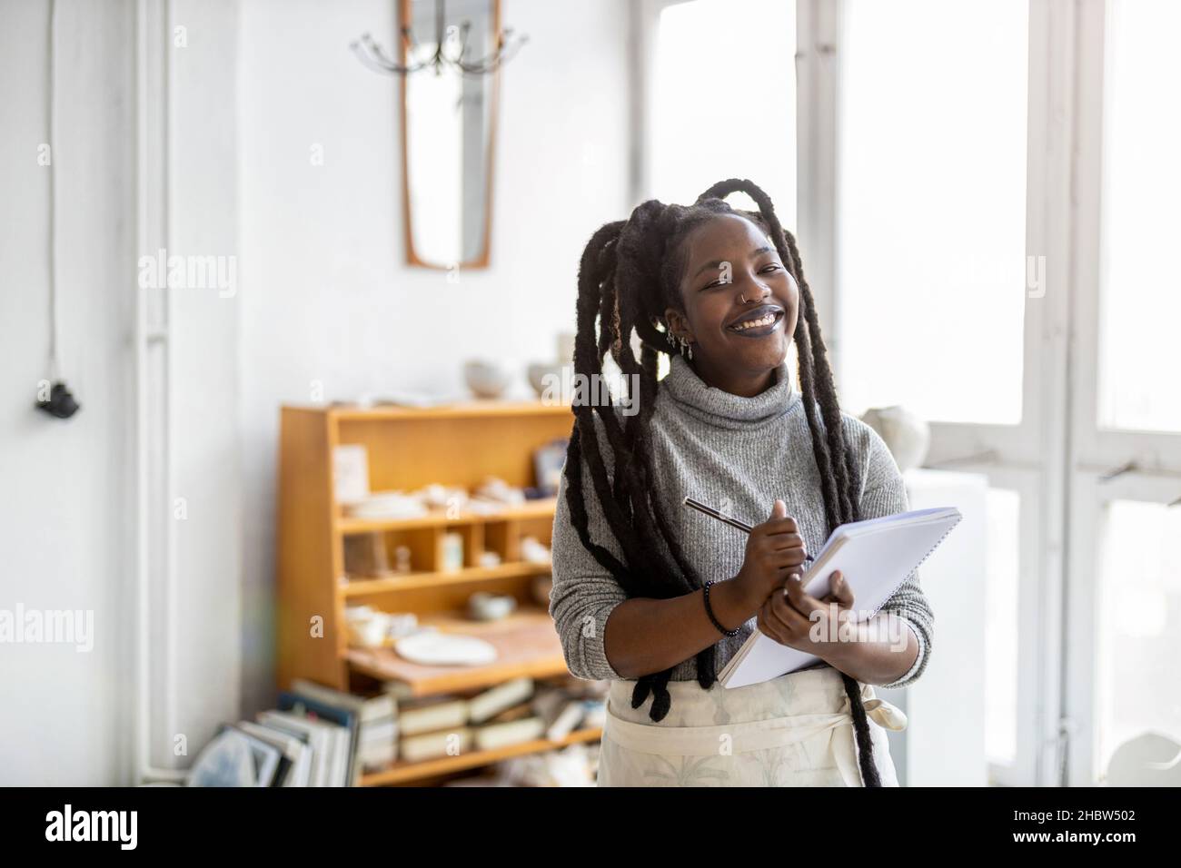 Woman pottery artist working in her art studio Stock Photo - Alamy