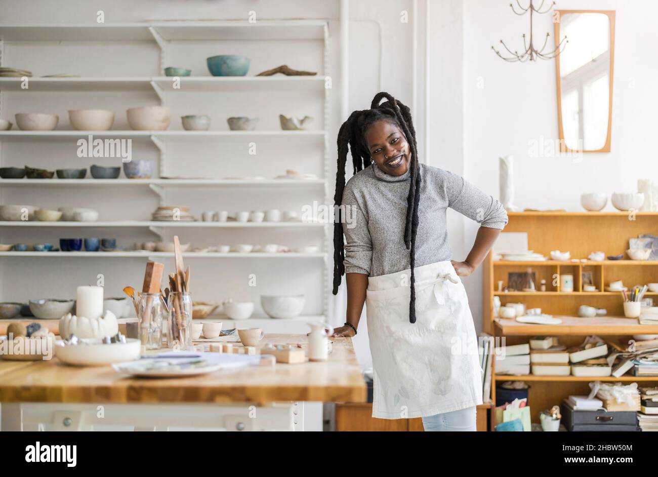 Woman pottery artist working in her art studio Stock Photo - Alamy
