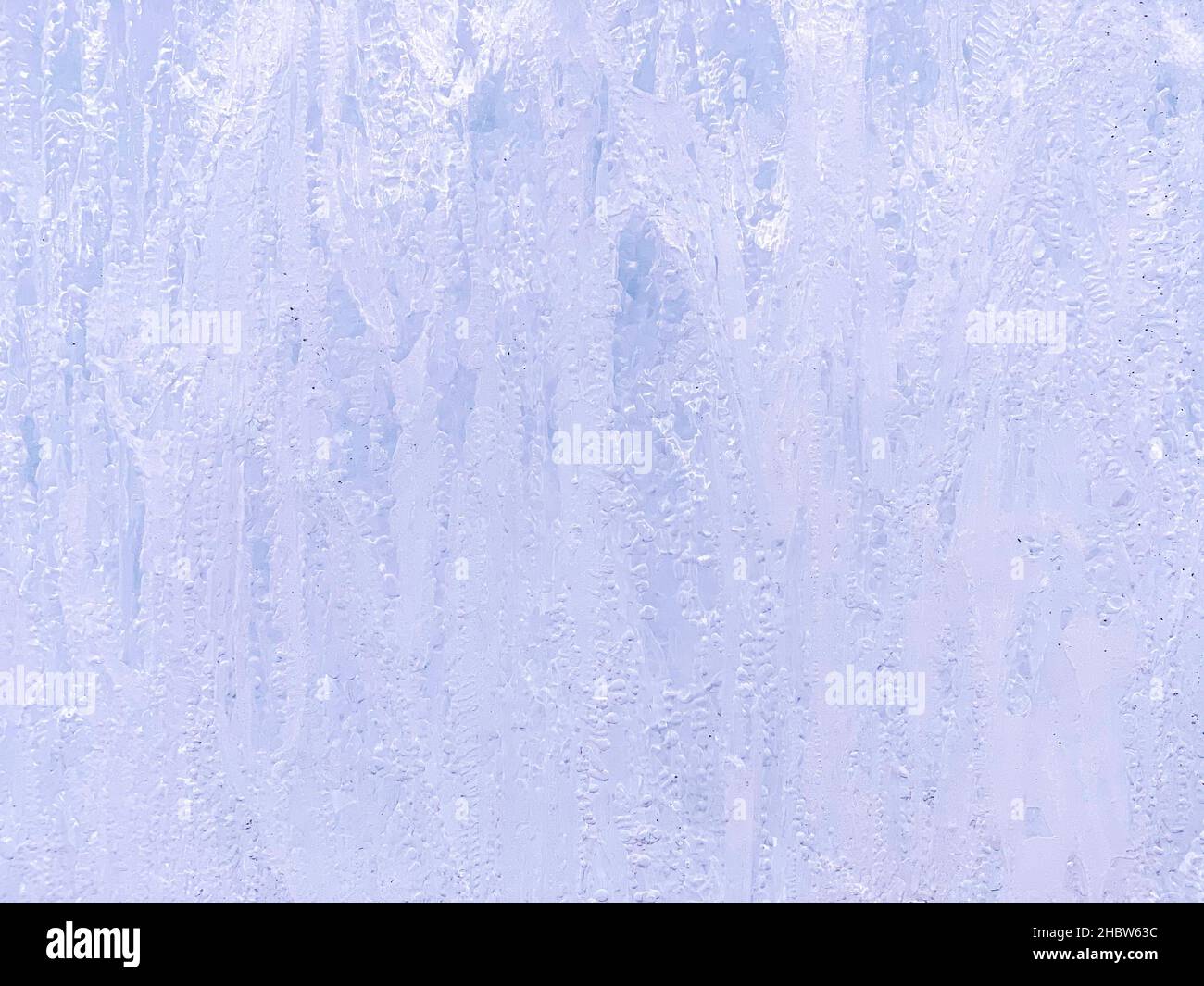 Abstract background. Vertical ice smudges of purple purple color with a pearlescent tint. Stock Photo