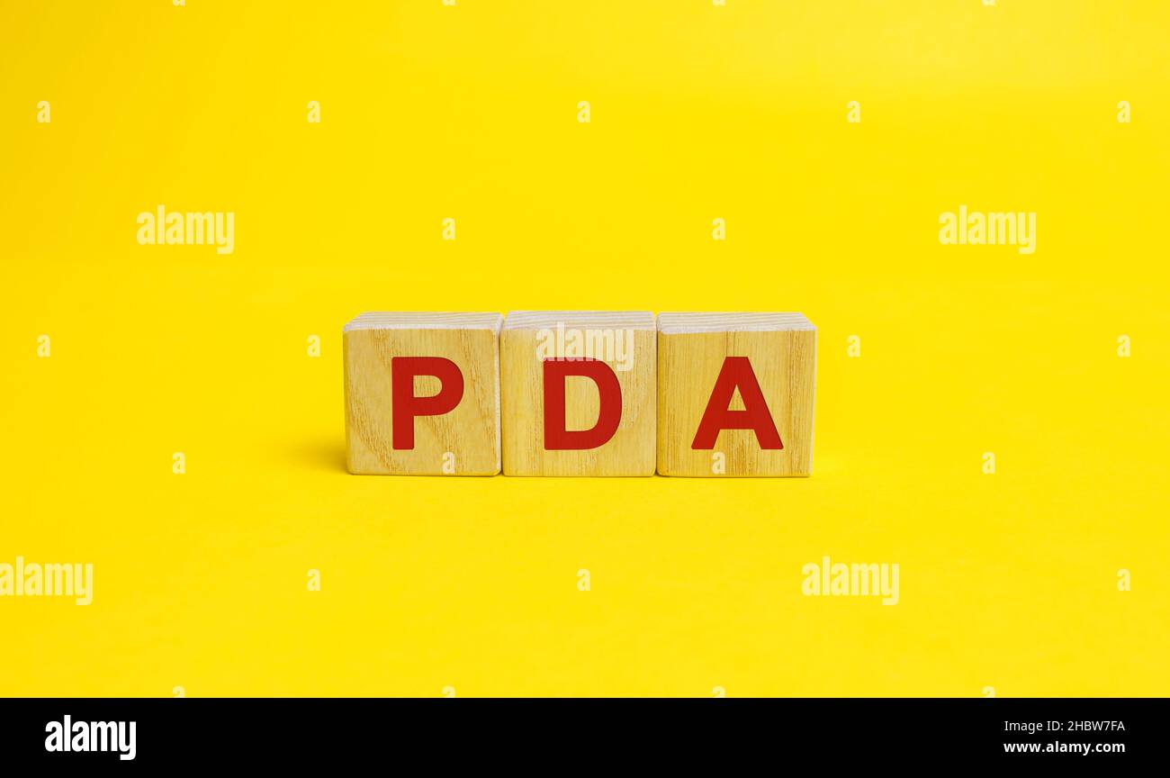 Wooden blocks with the word PDA. Personal Digital Assistant acronym