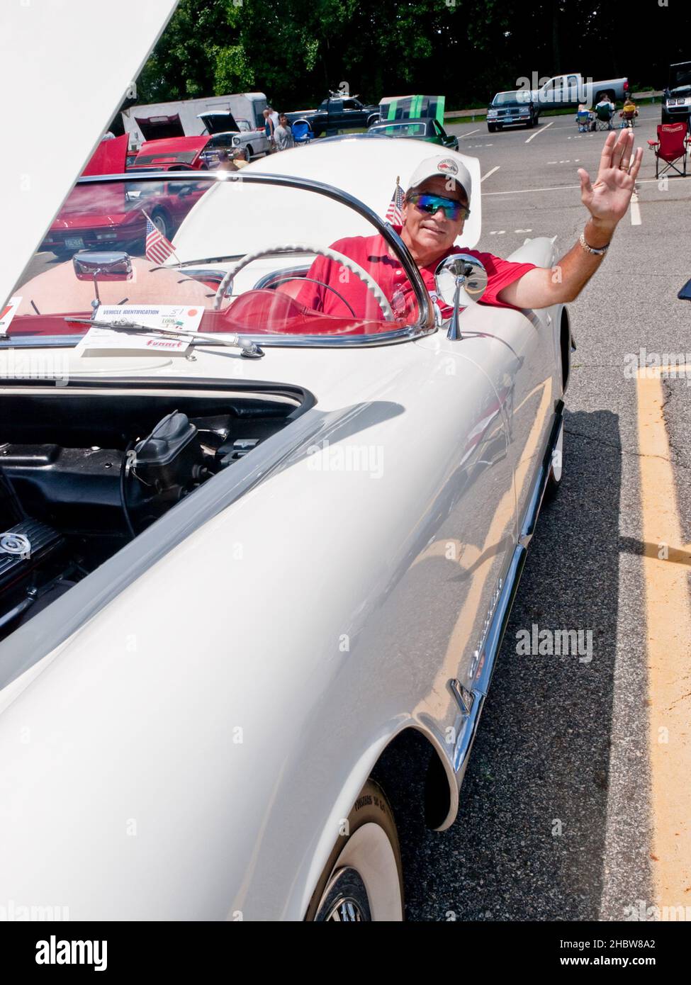 Oakland - July 18 - 22040 Ninth annual Summer Classic Car Show Indian Hills High School.  Ron Banta waves from his 1954 Corvette one of only 3600 made Stock Photo