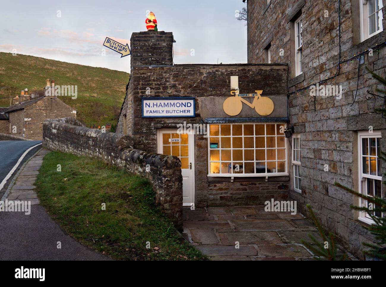 A village butchers shop with Christmas decoration, Bainbridge, Yorkshire Dales National Park, UK. Stock Photo