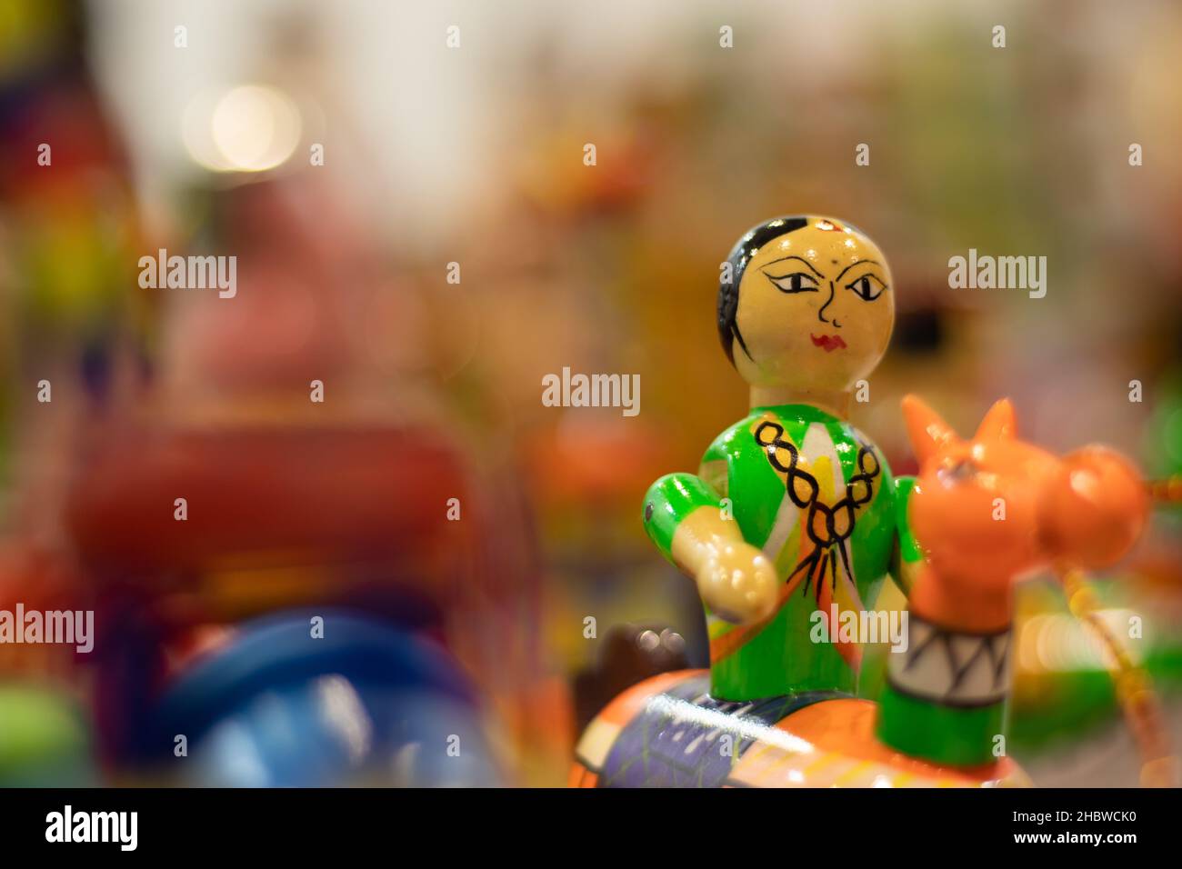 Multicolored Traditional Cultural Indian Girl Or Woman Riding Horse. Toy For New Born Babies Infants Or Kids. Eco Friendly Colorful Handmade Wooden Ch Stock Photo