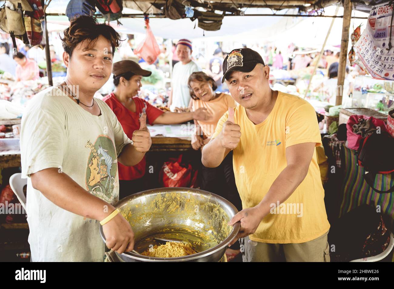 LA CARLOTA CITY, PHILIPPINES - Feb 01, 2019: Cheerful people buy and sell food at the Filipino native market, La Carlota City, Philippine Stock Photo