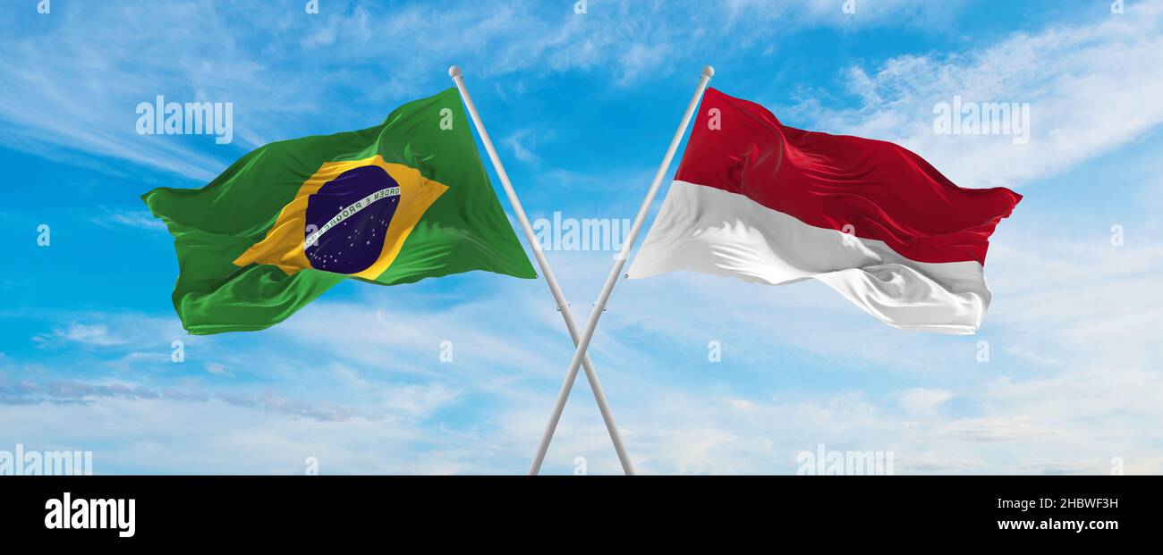 crossed national flags of Brazil and Indonesia flag waving in the wind ...