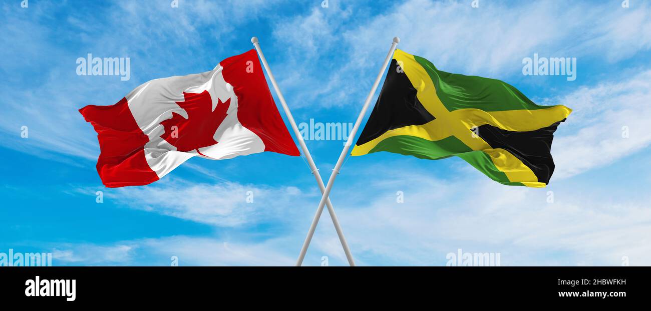 crossed national flags of Canada and Jamaica flag waving in the wind at ...
