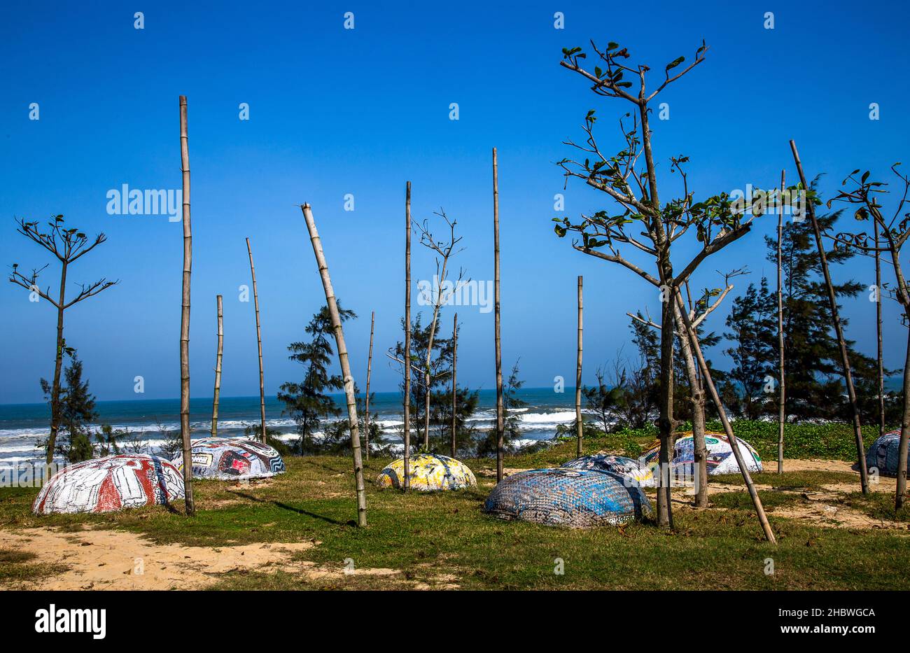Overlooking the beach and ocean with round Vietnamers Fishing Boats. Stock Photo
