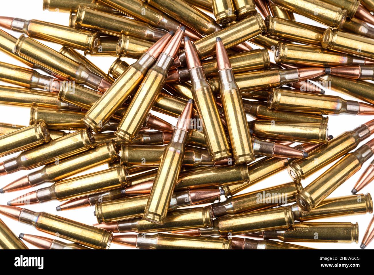 Ammunition for weapons. Lots of rifle cartridges on a white background ...