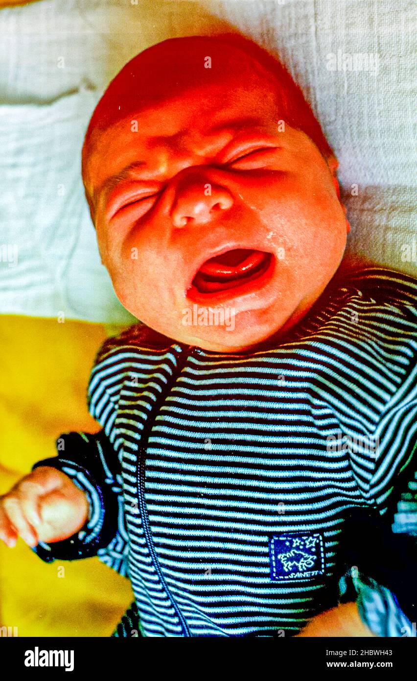 Angry crying baby Stock Photo - Alamy