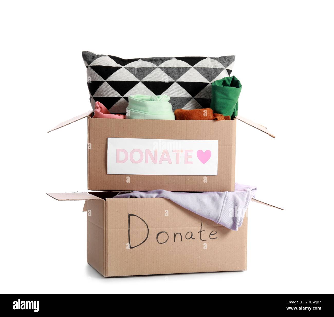 Cardboard boxes with donations on white background Stock Photo - Alamy