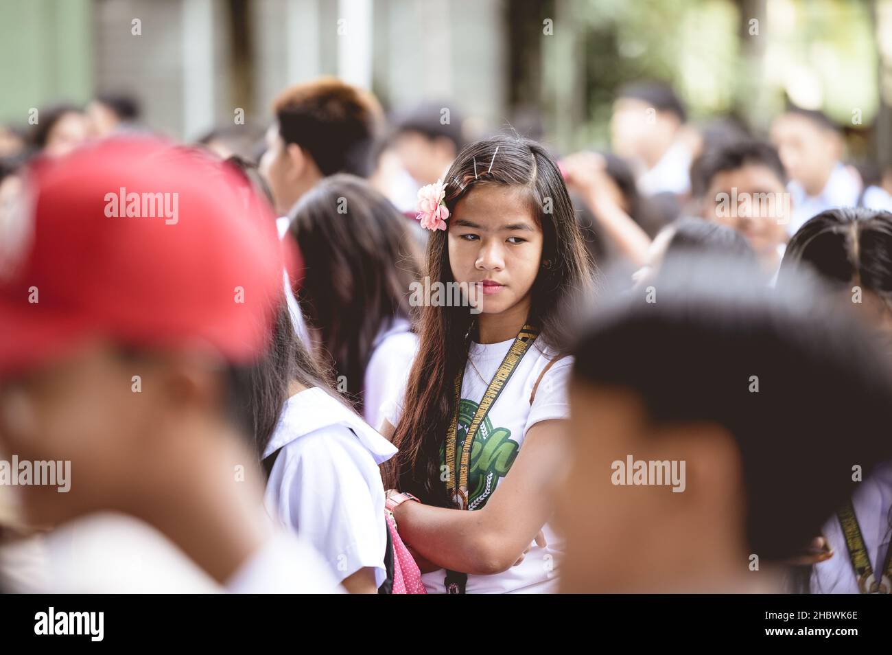 SCHOOL CHILDREN IN A FILIPINO SCHOOL WAITING FOR CLASS, PHILIPPINES - Jan 01, 2019: A group of Filipino school children waiting for class to start Stock Photo