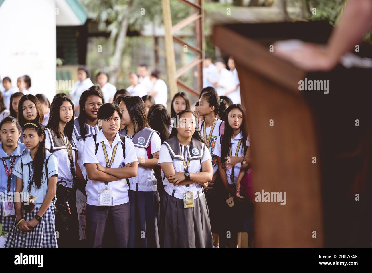 SCHOOL CHILDREN IN A FILIPINO SCHOOL WAITING FOR CLASS, PHILIPPINES - Jan 01, 2019: A group of Filipino students waiting for class to start Stock Photo