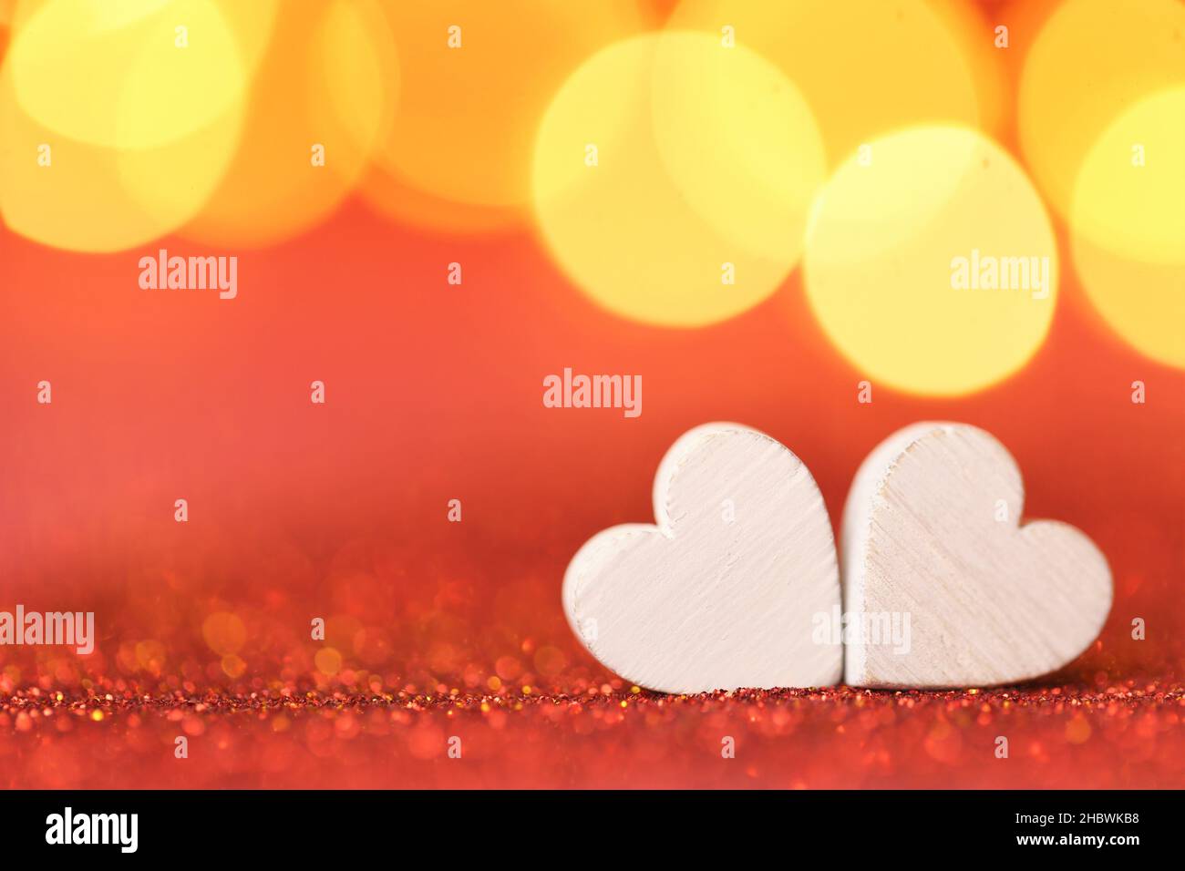 Love .Valentine's Day. Love symbol. two white hearts on a red glitter ...