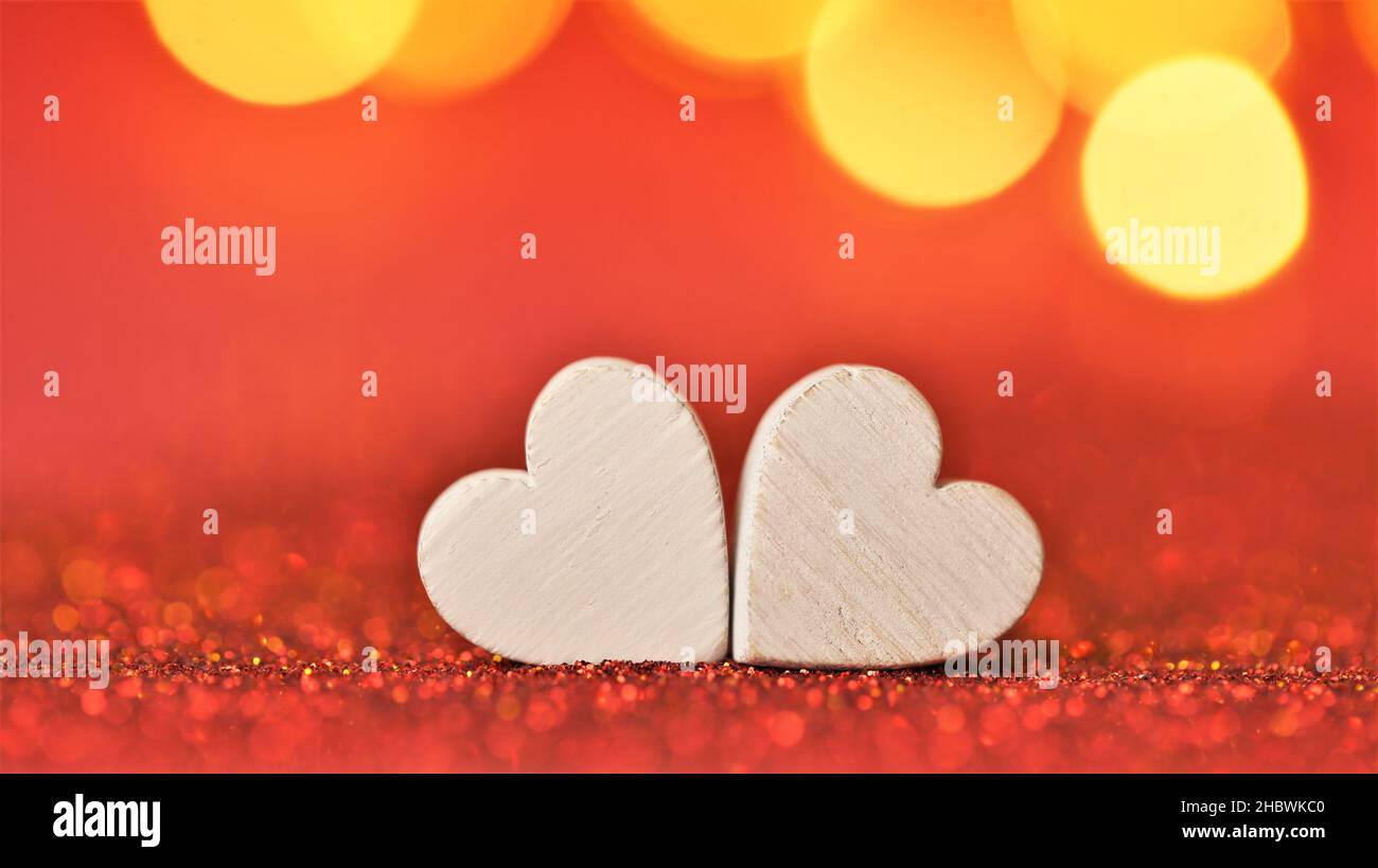 Valentine's Day. Love symbol. two white hearts on a red glitter ...