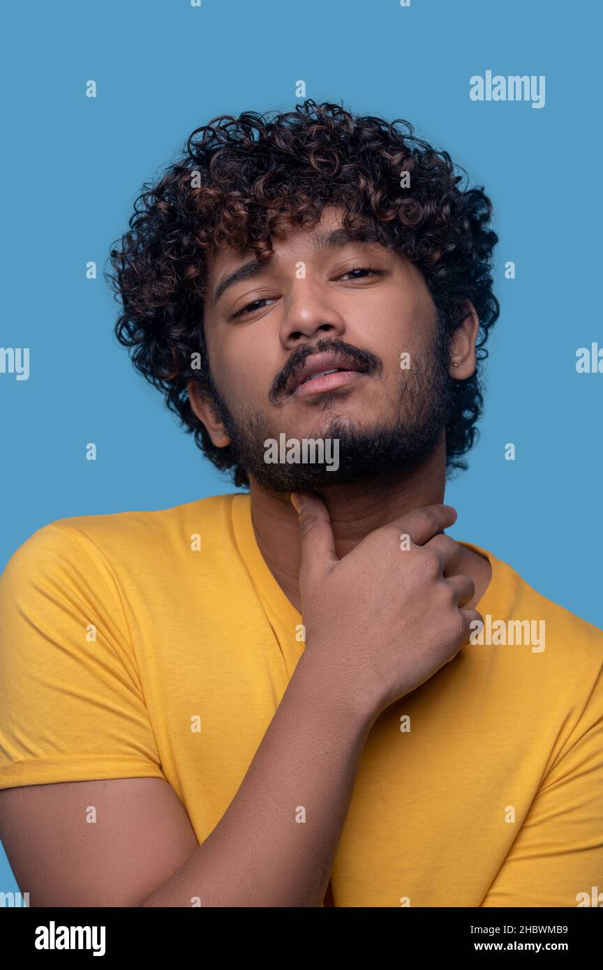 Cute curly haired indian man hi-res stock photography and images - Alamy