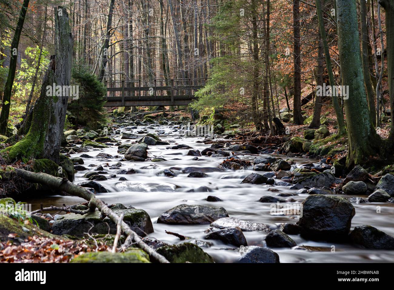 A beautiful shot of a streaming river and rocks in the middle of a ...