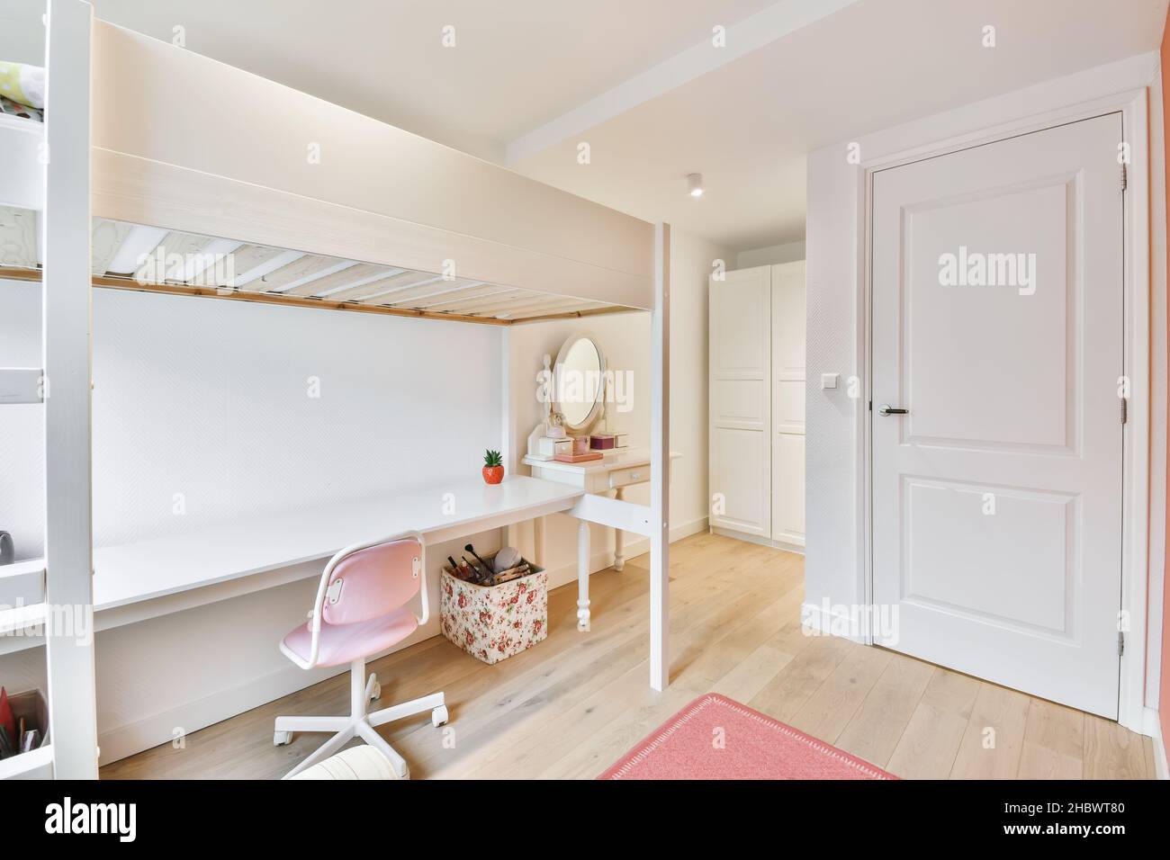 Lovely pink kids bedroom with comfy chair Stock Photo Alamy