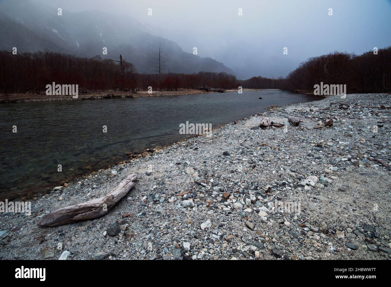 The rocky banks of the Azusa River in very early spring, Kamikochi, Japan. Stock Photo