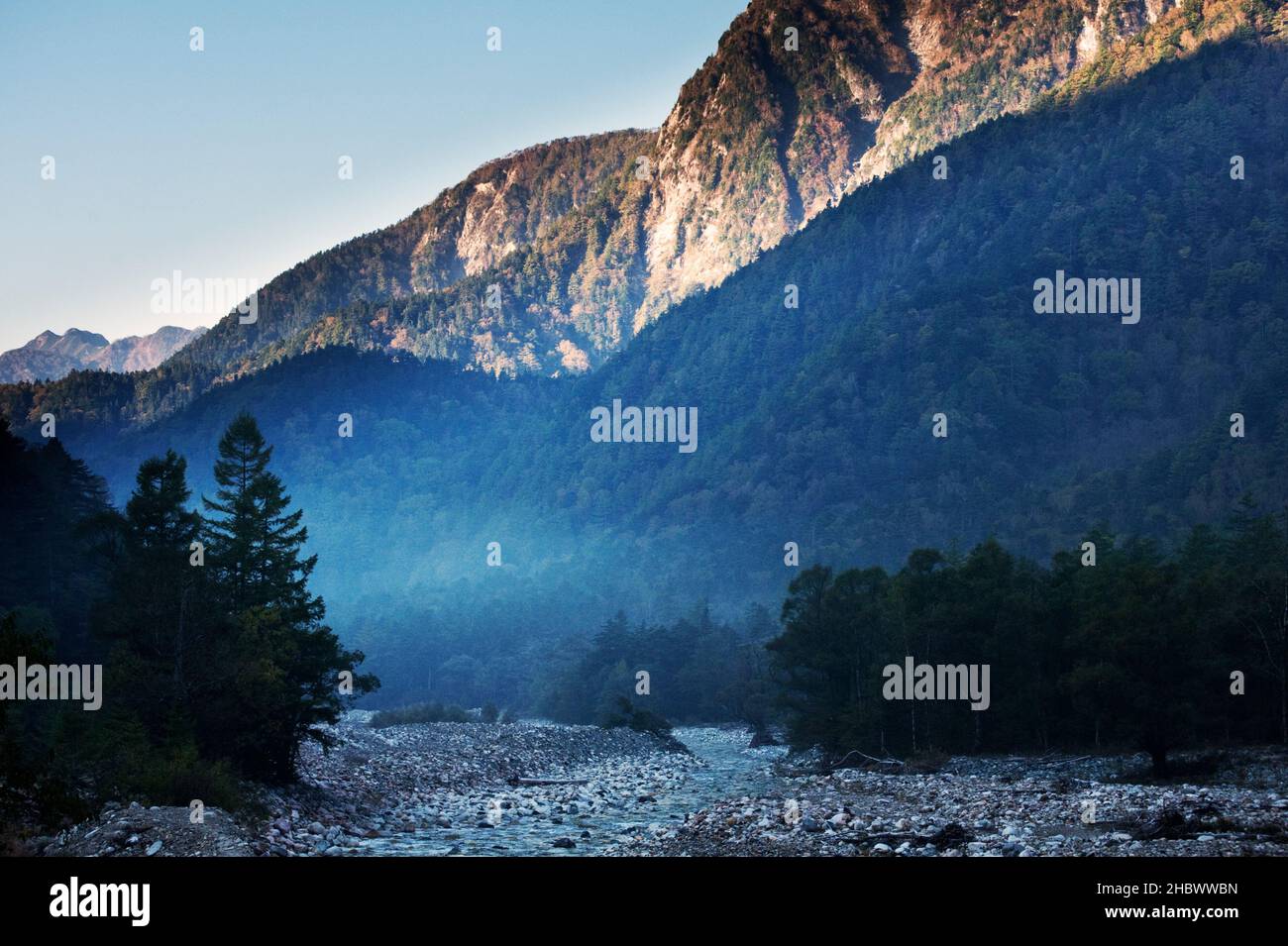 Morning mist rises from the Azusa River at Tokusawa, Kamikochi, Japan Stock Photo