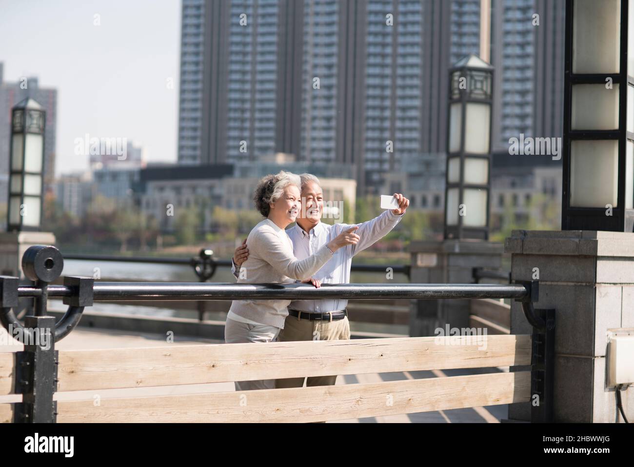 Happy old couple taking selfies with their mobile phone Stock Photo