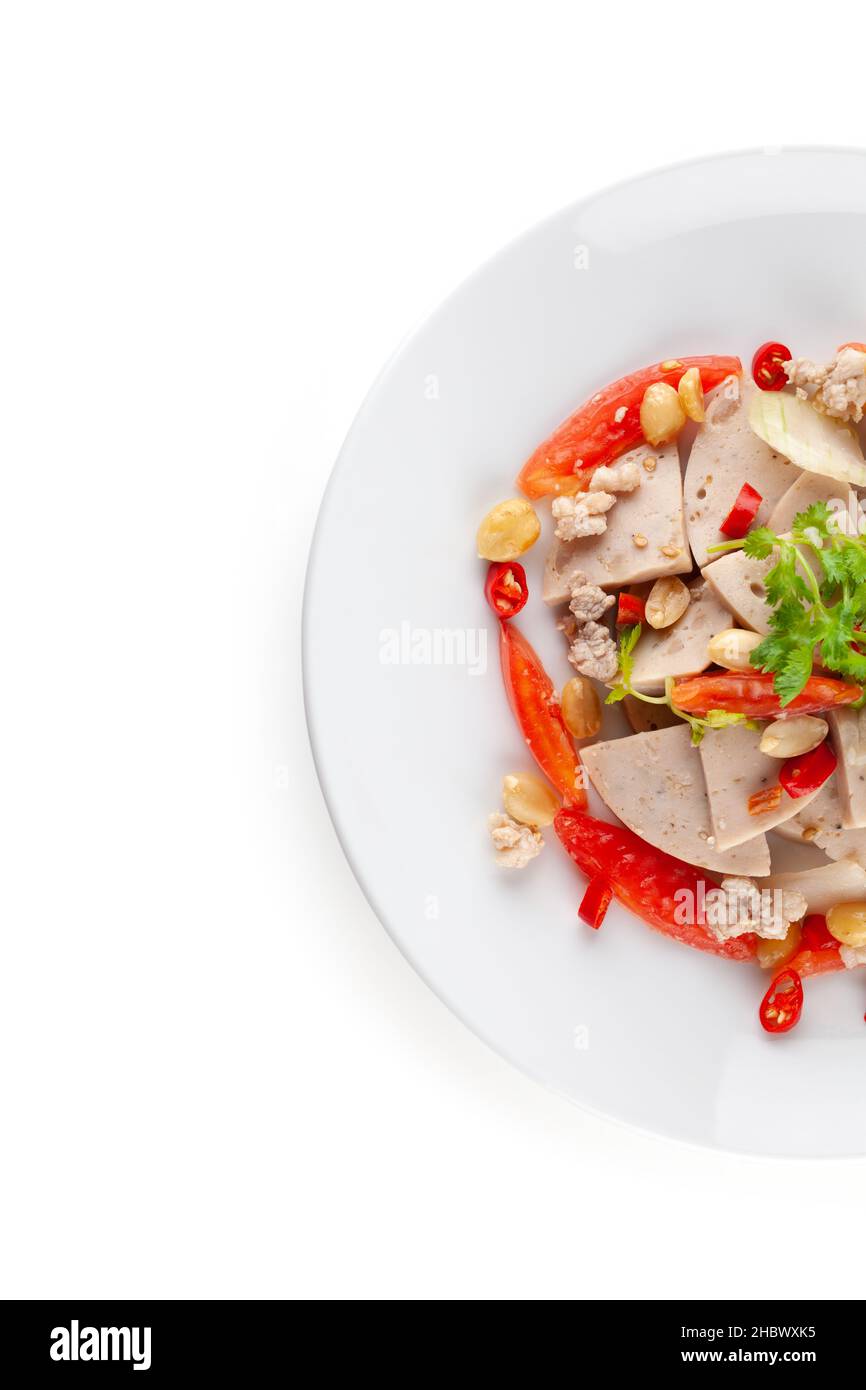 Spicy Vietnamese Sausage Salad on white ceramic plate isolated on white background with clipping path and soft shadow Stock Photo