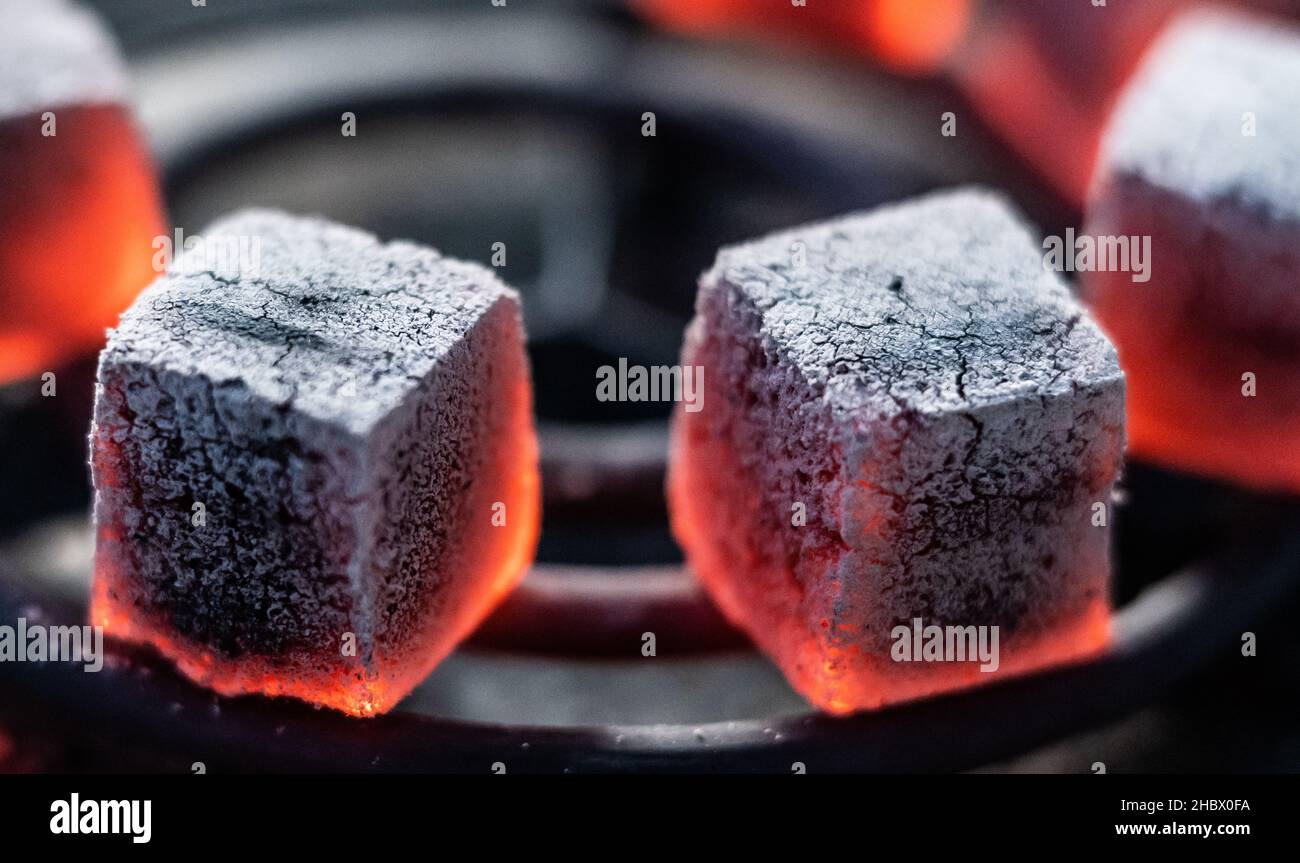 Rottweil, Germany. 19th Dec, 2021. Shisha charcoal is heated on a charcoal  grill and glows in the process. Credit: Silas Stein/dpa/Alamy Live News  Stock Photo - Alamy