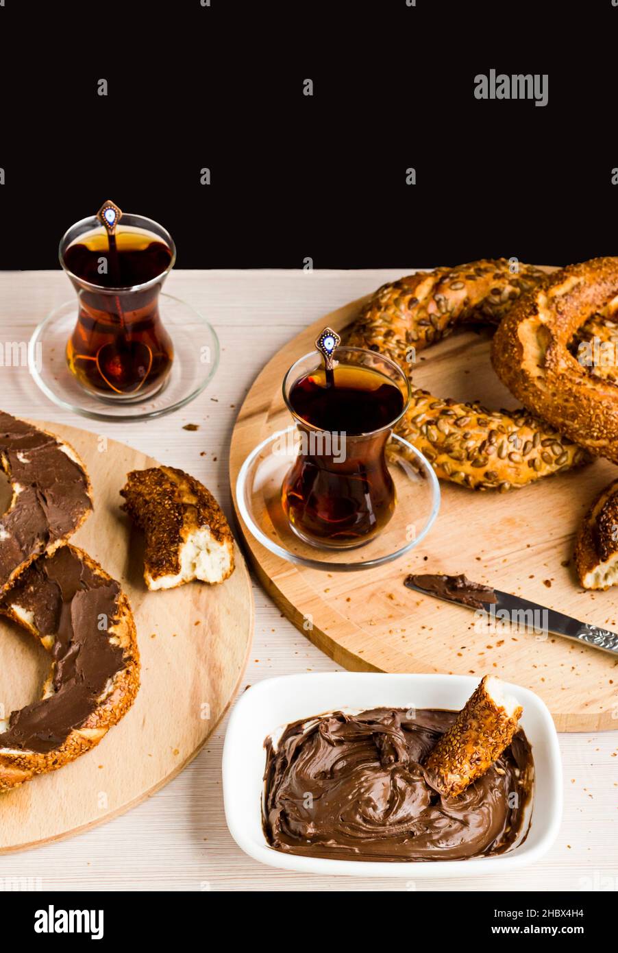 Traditional Turkish crispy bagel,simit with cream chocolate on the ...