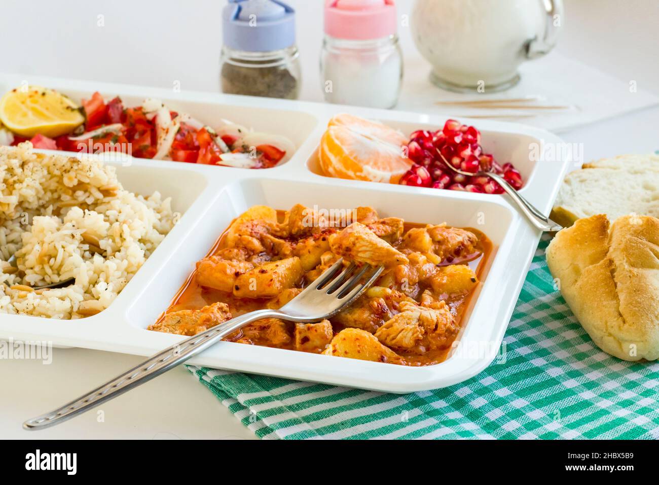 Traditional Turkish Meal with chicken potato,rice,tomato salad and