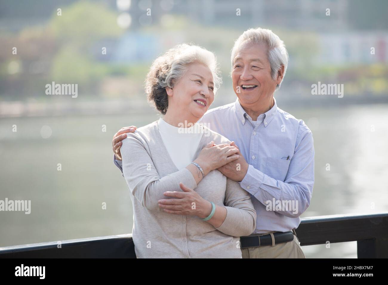 Happy elderly couple resting in the park Stock Photo