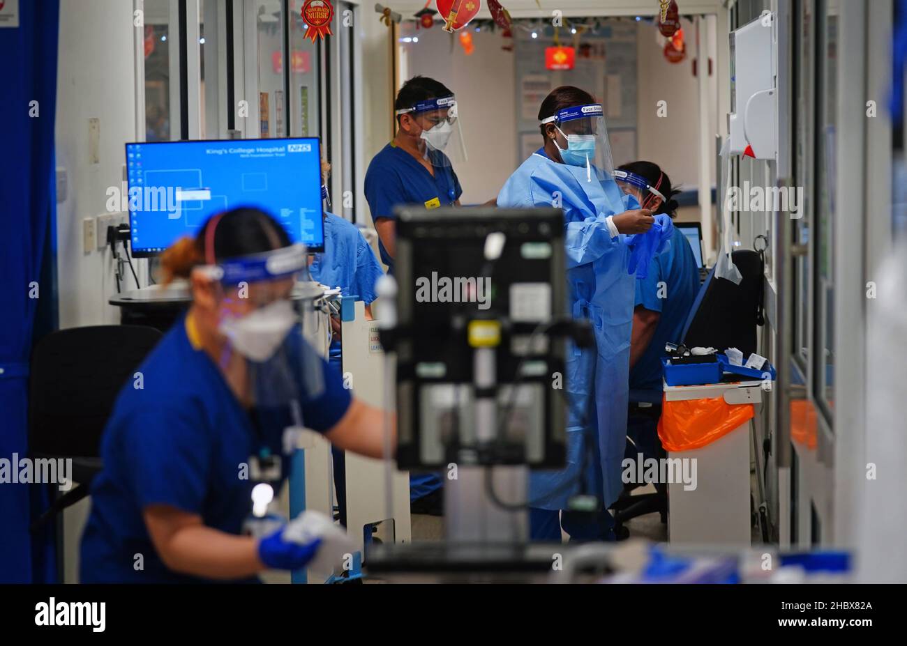 Medical staff wearing PPE work in a corridor on a ward for Covid
