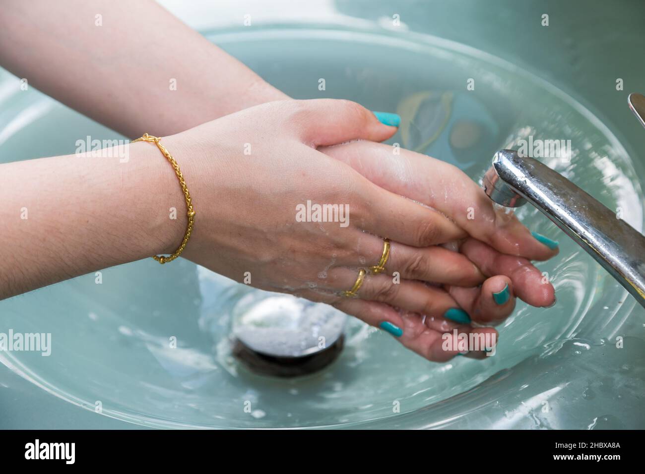 Washing of hands with soap under running water Stock Photo - Alamy