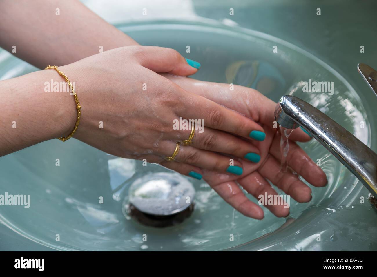 Washing of hands with soap under running water Stock Photo - Alamy