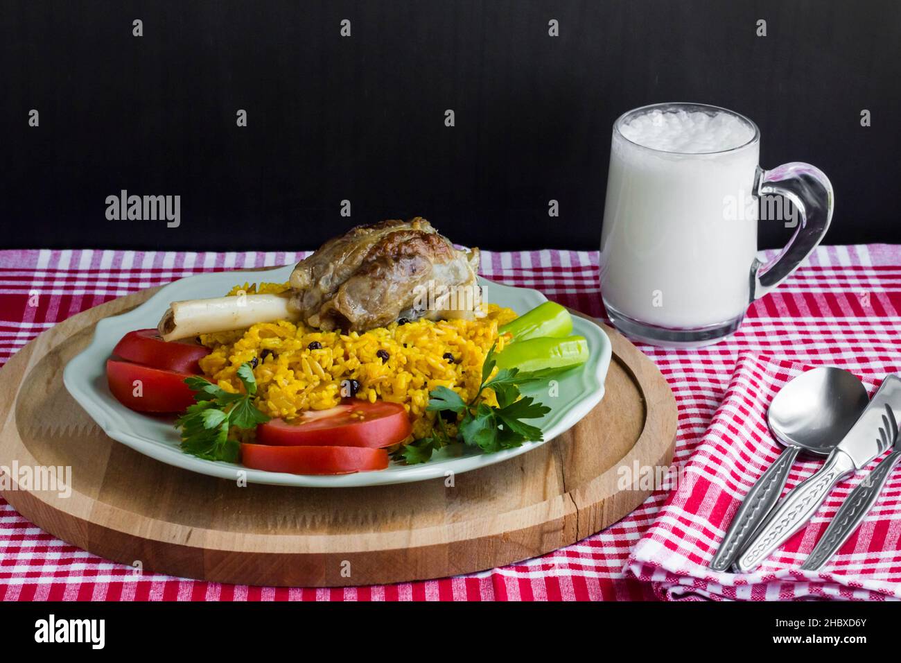 Traditional Saffron Arabian Rice with lamb shank on the wooden tray
