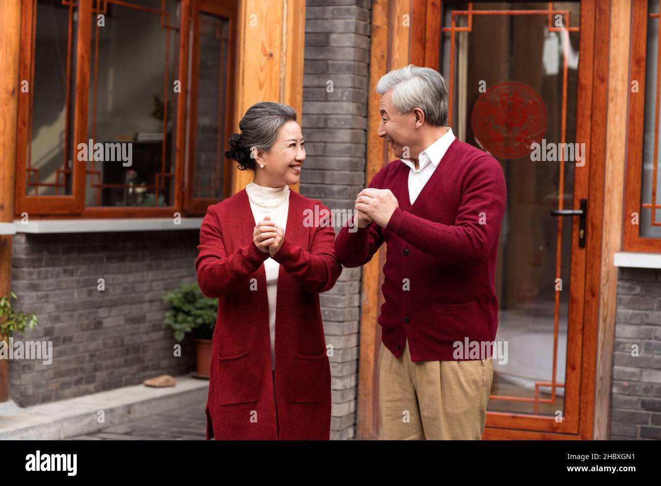 Old couple celebrating New Year Stock Photo